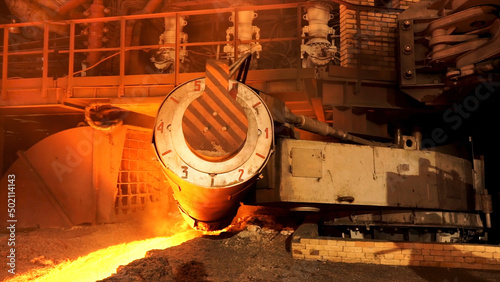 Close up for the steel furnace with temerature indicators at the metallurgical factory shop, heavy metallurgy concept. Stock Footage. Working mechanism at the metal smelting plant. photo