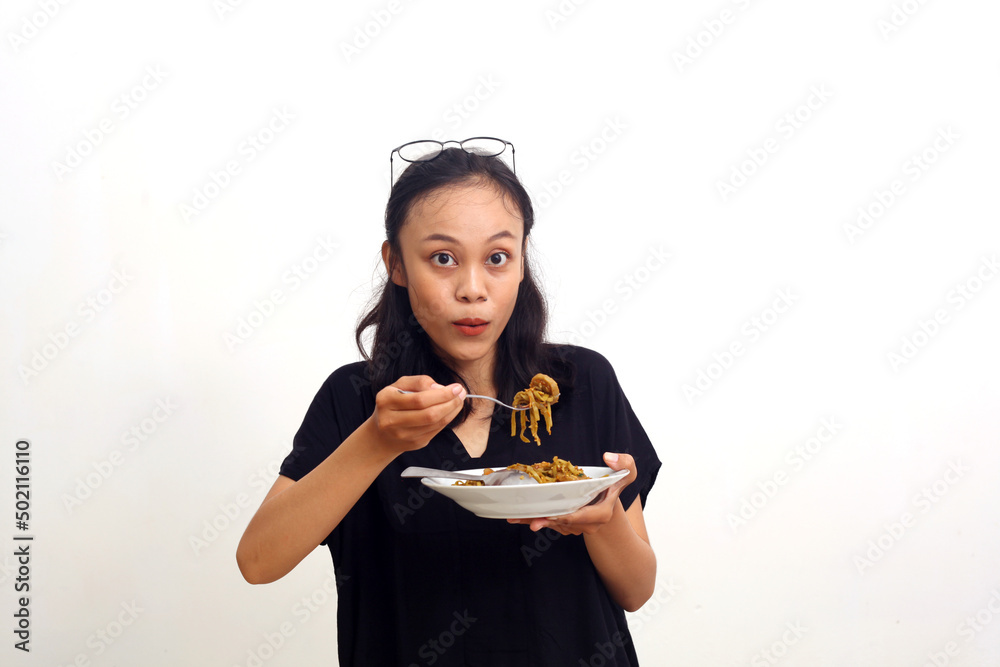 Asian young woman holding a plate of noodle. Isolated on white background Asian young woman holding a plate of noodle. Isolated on white background