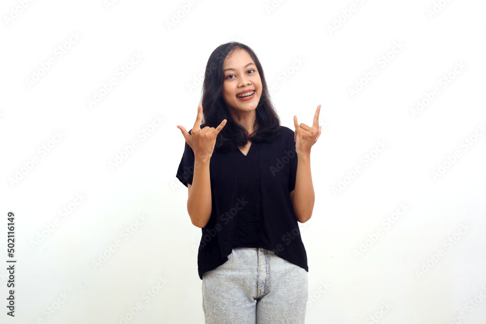asian woman standing with metal sign gesture. isolated on white asian woman standing with metal sign gesture. isolated on white