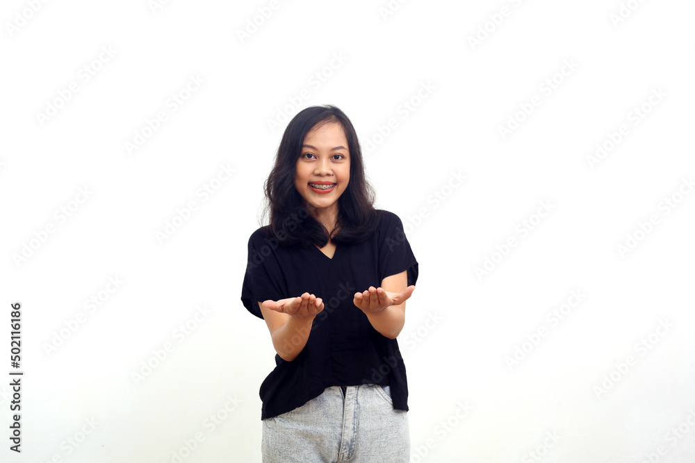 Asian woman standing smiling and showing something with open palms. isolated on white Asian woman standing smiling and showing something with open palms. isolated on white