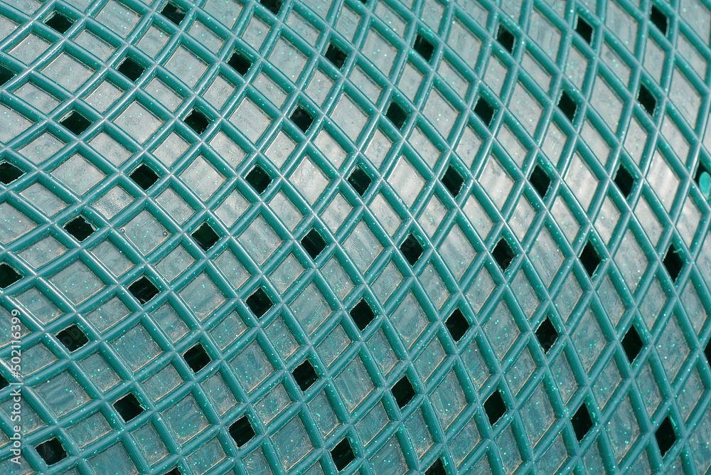green texture of plastic grating in the wall