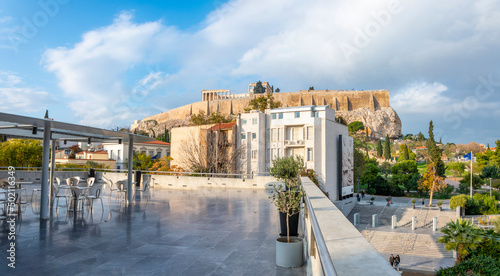 Acropolis Hill and ancient Greek ruins viewed from the rooftop terrace of the Acropolis Cafe at the Acropolis Museum in the historic Plaka district of Athens Greece.