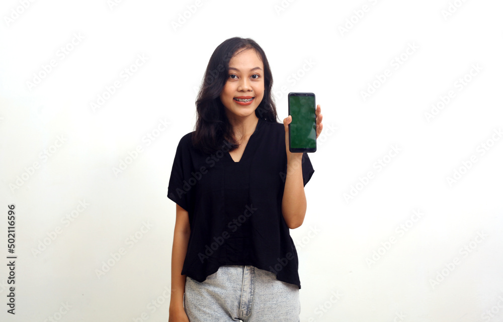 Happy young asian woman showing a blank screen. Isolated on white background Happy young asian woman showing a blank screen. Isolated on white background