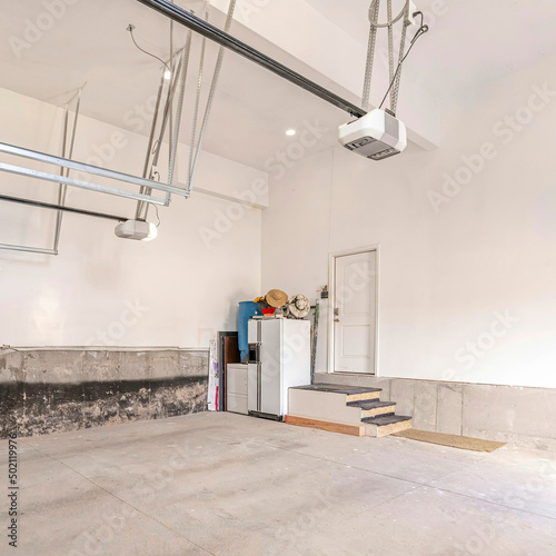 Square Large concrete garage exterior with automatic door operators