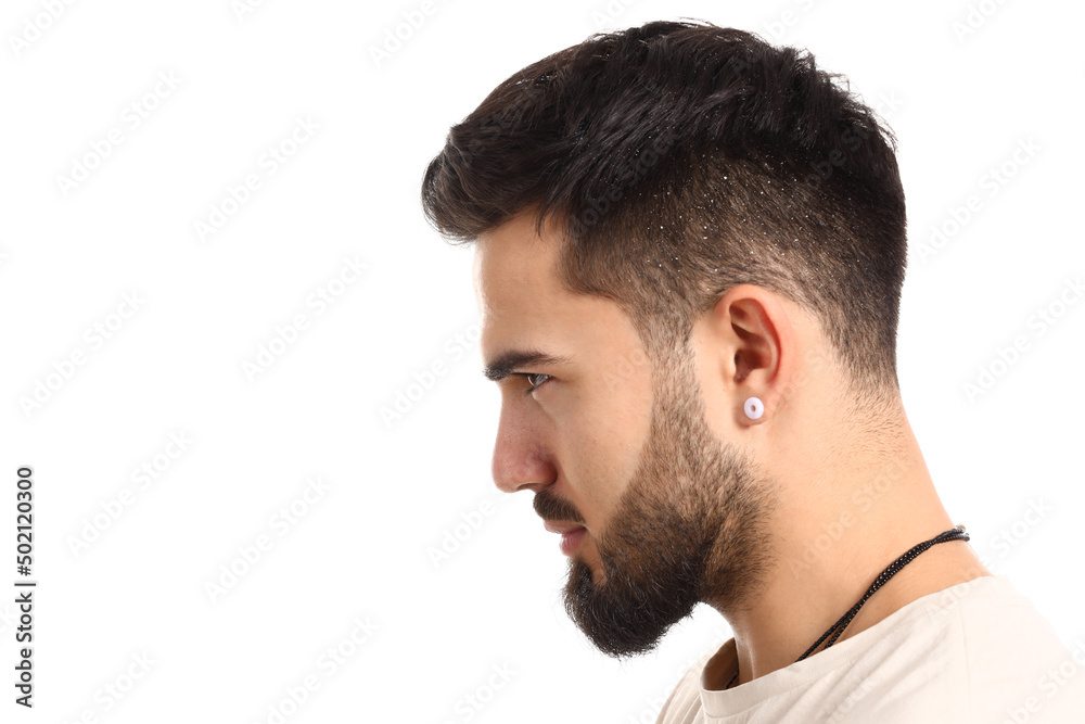Young man with problem of dandruff on white background Young man with problem of dandruff on white background