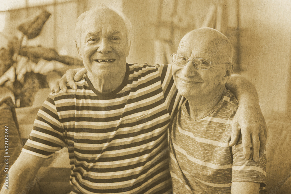 Fototapeta premium Old photo of happy elderly men at home