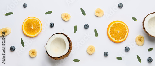 Sweet tropical fruits on light background