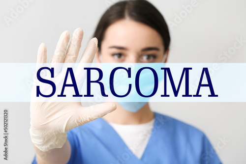 Female doctor and word SARC...