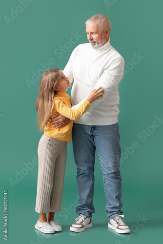 Little girl with her grandf...