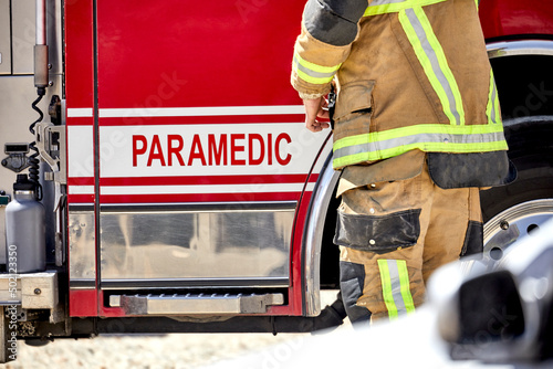 Fire Fighter paramedic standing by truck © Pamela Au