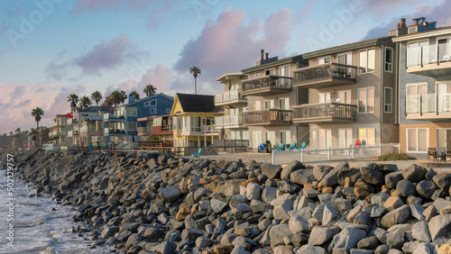 Canvastavla Panorama Puffy clouds at sunset Residential buildings at the coastal area of Oce
