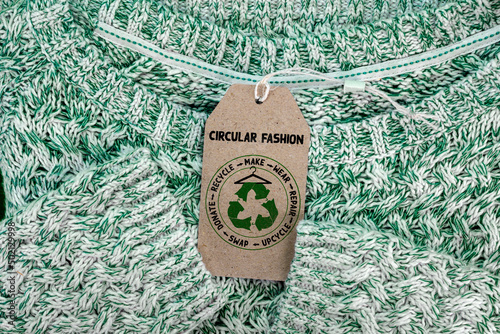 Circular Fashion label on jumper, , make, wear, repair, upcycle, swap, donate, recycle with eco clothes recycle icon sustainable fashion concept