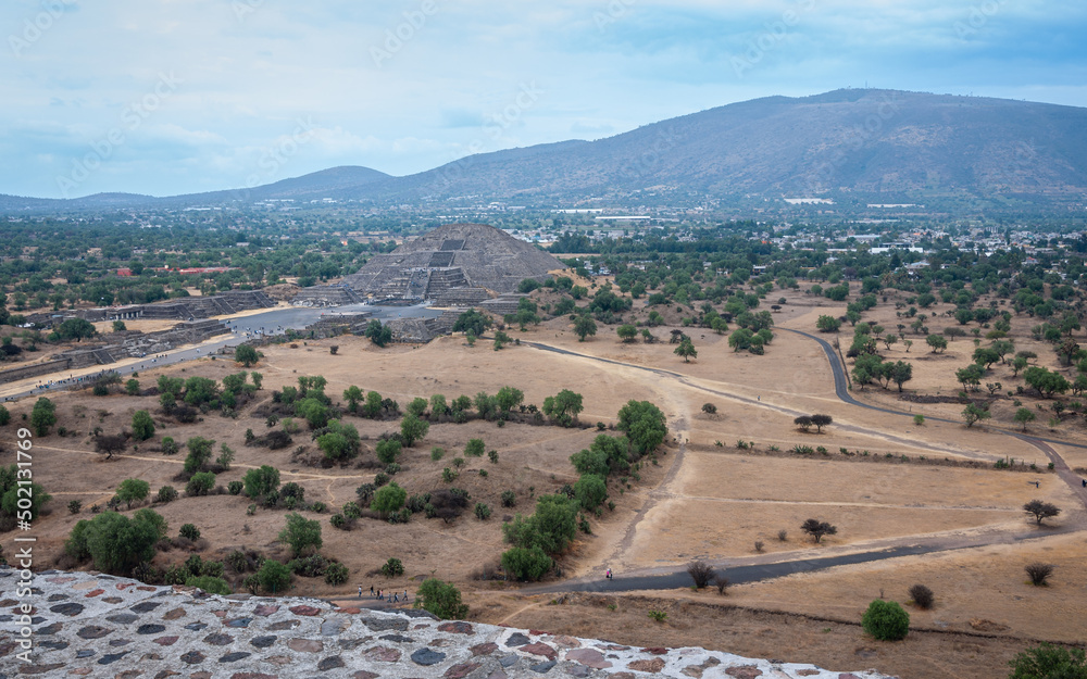 Panoramic landscape of the Pyramid of the Moon, at Teotihuacan, an ancient pre-Aztec City and archeological site in Central Mexico. View from above on top of the Pyramid of the Sun.