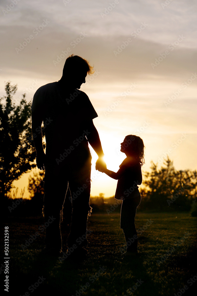 Loving Father and Little Girl Child Holding Hands Outside Enjoyi