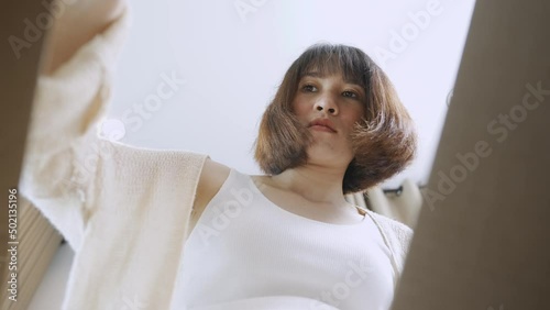 female unpack online parcel at home