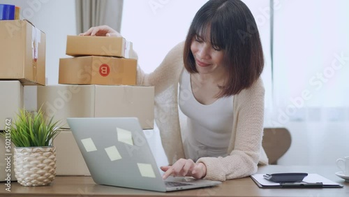 Happy female online selling at home, Startup project or small business enterprise.