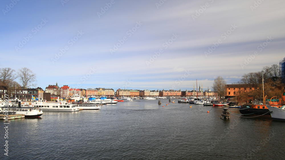 View on a canal with many boats at Skeppsholmen in the city of Stockholm