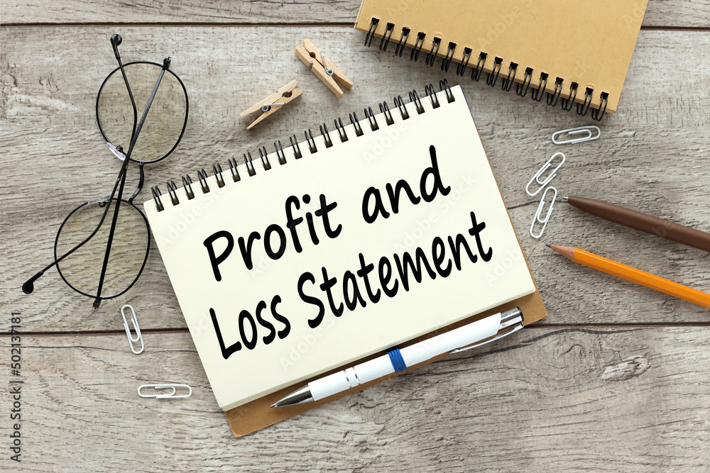 profit and loss statement. text on open notepad near glasses - obrazy, fototapety, plakaty 