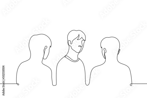 man stands looking at the viewer he turned around while others stand with their backs and look at him - one line drawing vector. concept to change your mind, change your mind, suspect