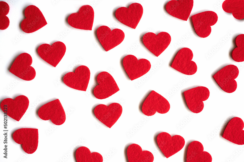Red felt hearts on the white background