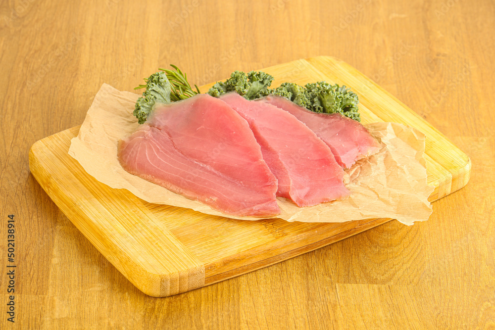 Raw salted tuna slice over board Raw salted tuna slice over board