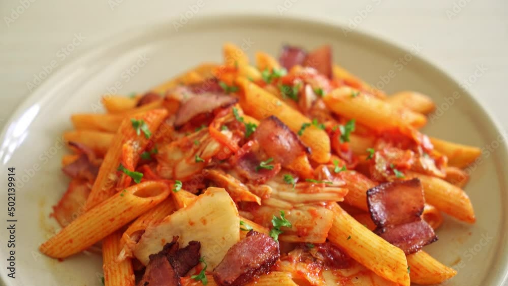 stir-fried penne pasta with kimchi and bacon - fusion food stir-fried penne pasta with kimchi and bacon - fusion food