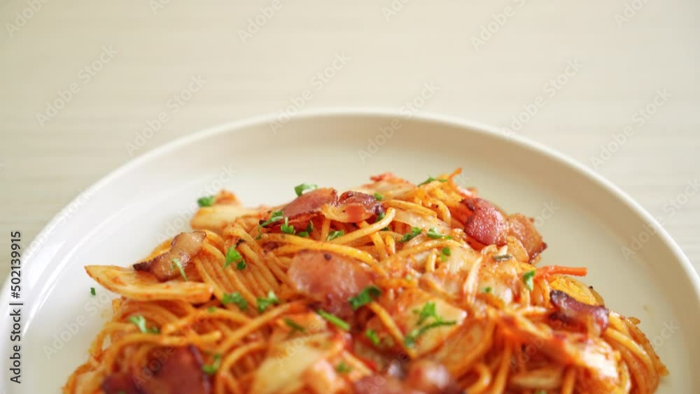 stir-fried spaghetti with kimchi and bacon - fusion food style stir-fried spaghetti with kimchi and bacon - fusion food style