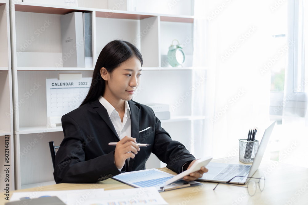 Young Asian women are talking friends and manager through video chats and greeting them with cheerful expressions, Online communication , Stay home, New normal, VDO Call, Internet working. Young Asian women are talking friends and manager through video chats and greeting them with cheerful expressions, Online communication , Stay home, New normal, VDO Call, Internet working.