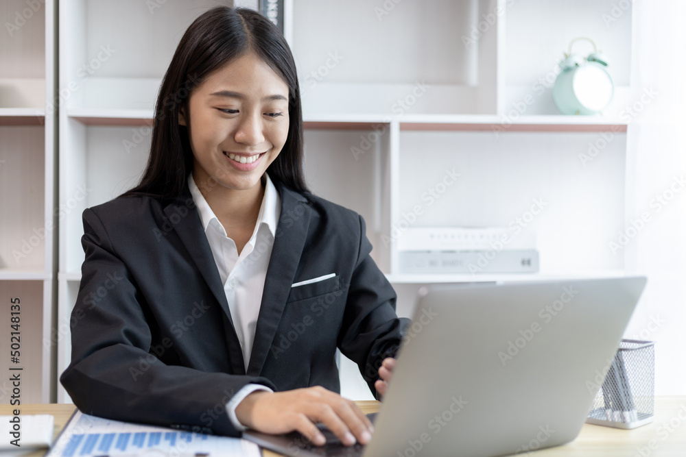 Businesswoman's hand presses on a laptop keyboard, World of technology and internet communication, Using computers to conduct financial transactions because the convenience and speed, Working concept. Businesswoman's hand presses on a laptop keyboard, World of technology and internet communication, Using computers to conduct financial transactions because the convenience and speed, Working concept.