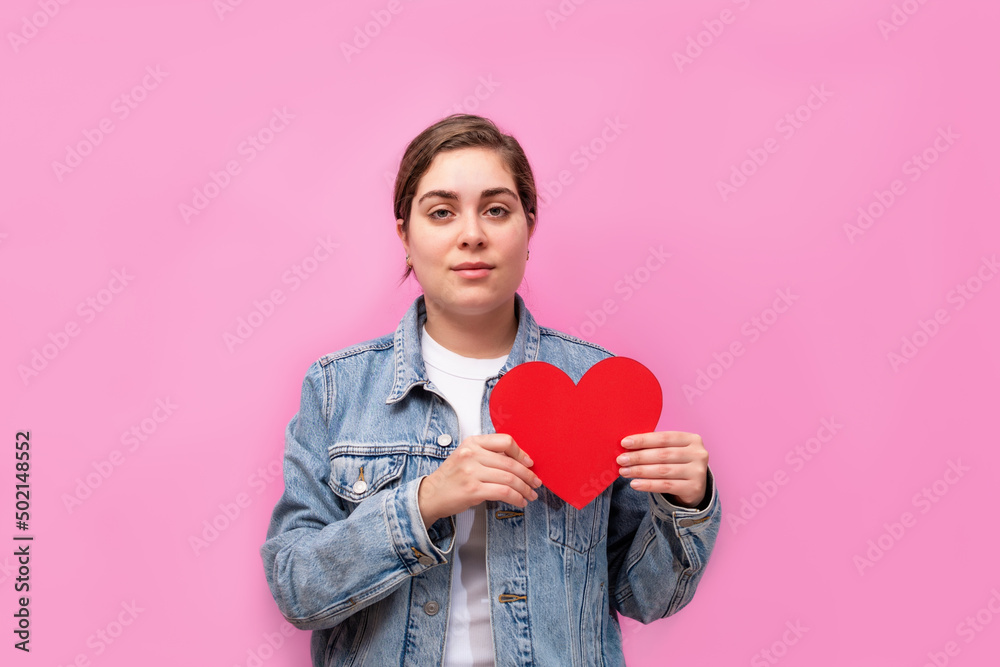 Love and valentines day woman. Young woman portrait holding red Heart. Love and valentines day woman. Young woman portrait holding red Heart.