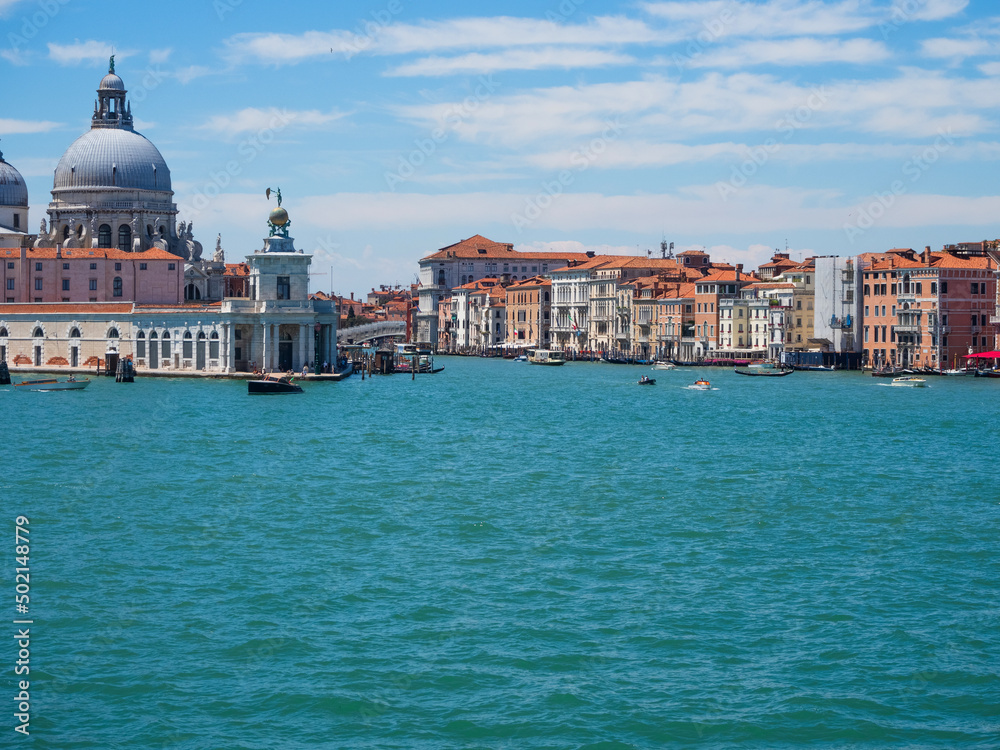 The grand canal in venice with car ferry in italy with cityscape view.