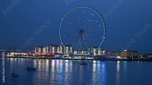 4K: Ain Dubai, the world's biggest and tallest Ferris wheel during blue hours, View of Bluewaters Island in Dubai. photo