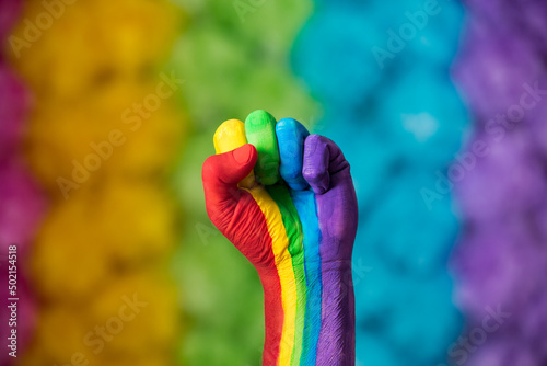 Fotografie, Obraz Rainbow colors painted hand raised making fist, sign