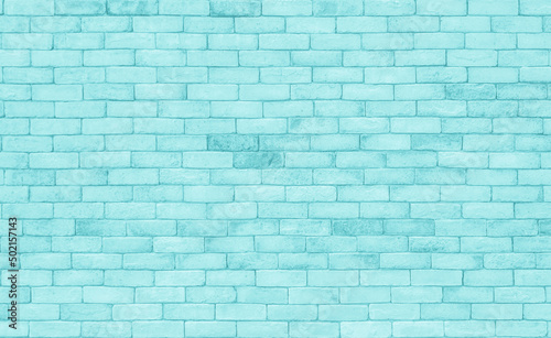 Brick wall painted with blue dark paint pastel calm tone texture background. Brickwork and stonework flooring interior design stack backdrop.