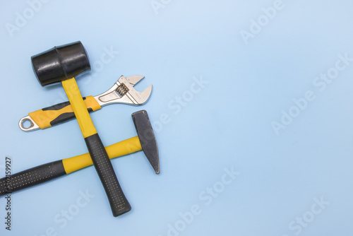 Cuadro en lienzo hammer, mallet, sanitary key on a light blue background with copy space