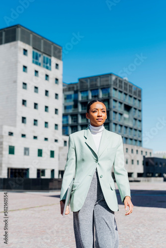 Wallpaper Mural Businesswoman walking in downtown district on footpath Torontodigital.ca