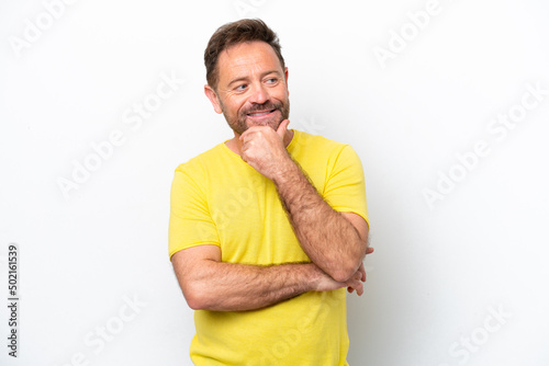 Middle age caucasian man isolated on white background looking to the side and smiling