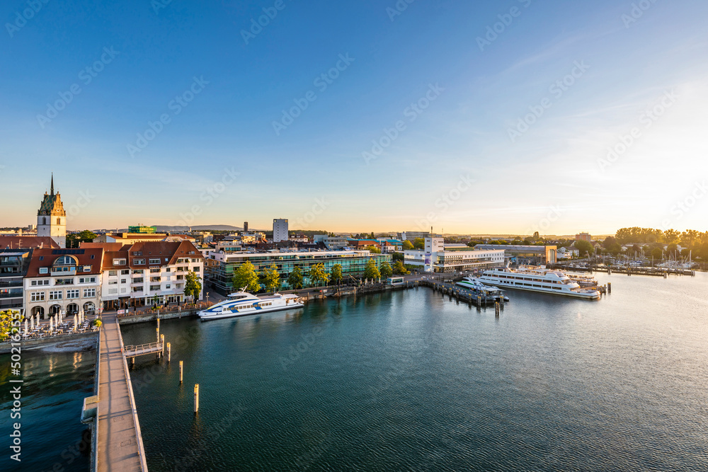 Germany, Baden-Wurttemberg, Friedrichshafen, Aerial view of town on shore of Lake Constance at sunrise Germany, Baden-Wurttemberg, Friedrichshafen, Aerial view of town on shore of Lake Constance at sunrise