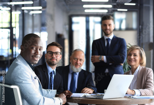 Portrait of a positive business employees at an office business meeting.