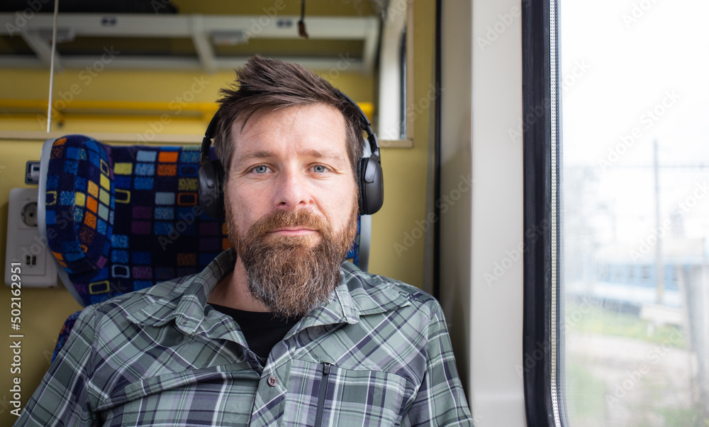 Obraz premium handsome man traveling on a train