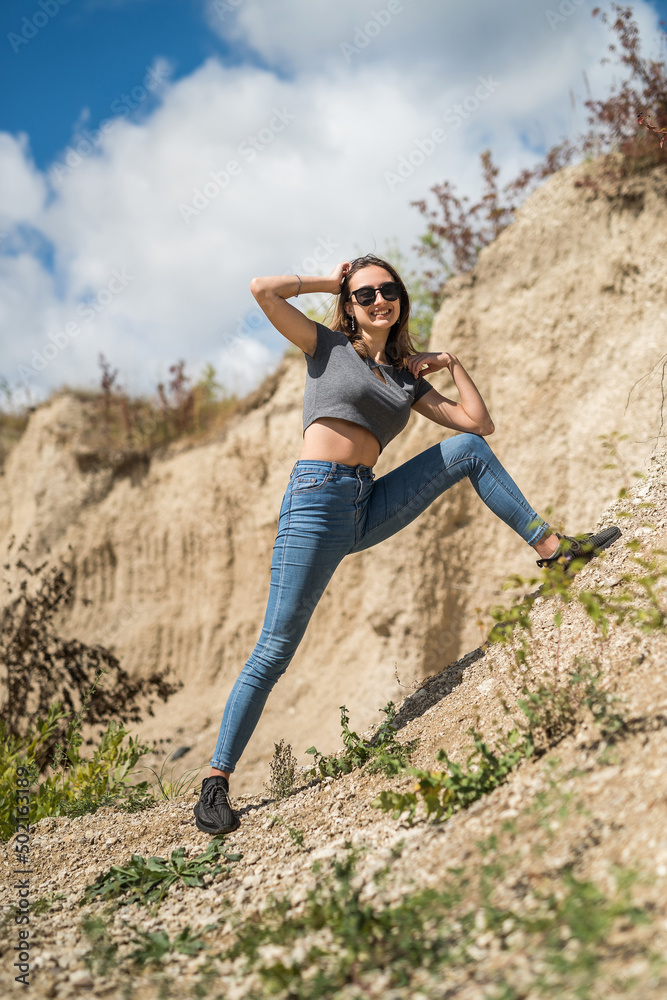 female model in casual cloth walk in sand quarry female model in casual cloth walk in sand quarry