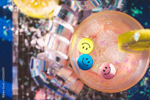Conceptual image about spare funny time at a disco party drinking fresh coctails