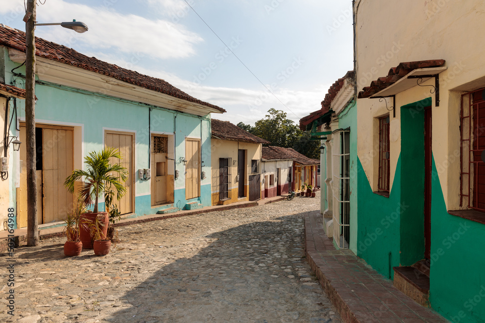 pitoresque street view, turquoise and yellow houses at pitoresque street view, turquoise and yellow houses at