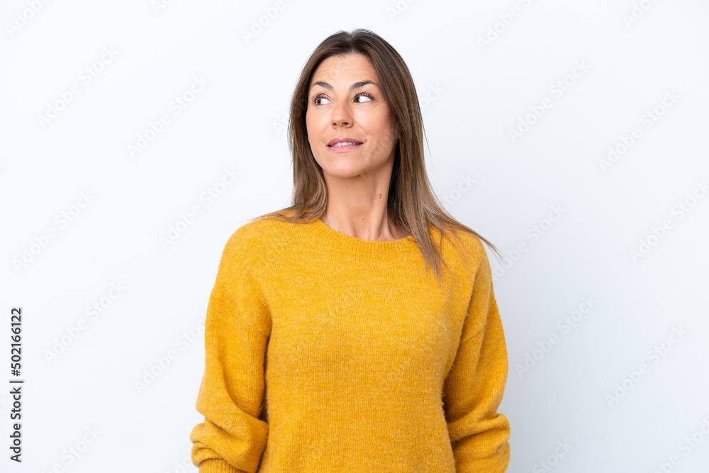 Middle age caucasian woman isolated on white background making doubts gesture looking side Middle age caucasian woman isolated on white background making doubts gesture looking side