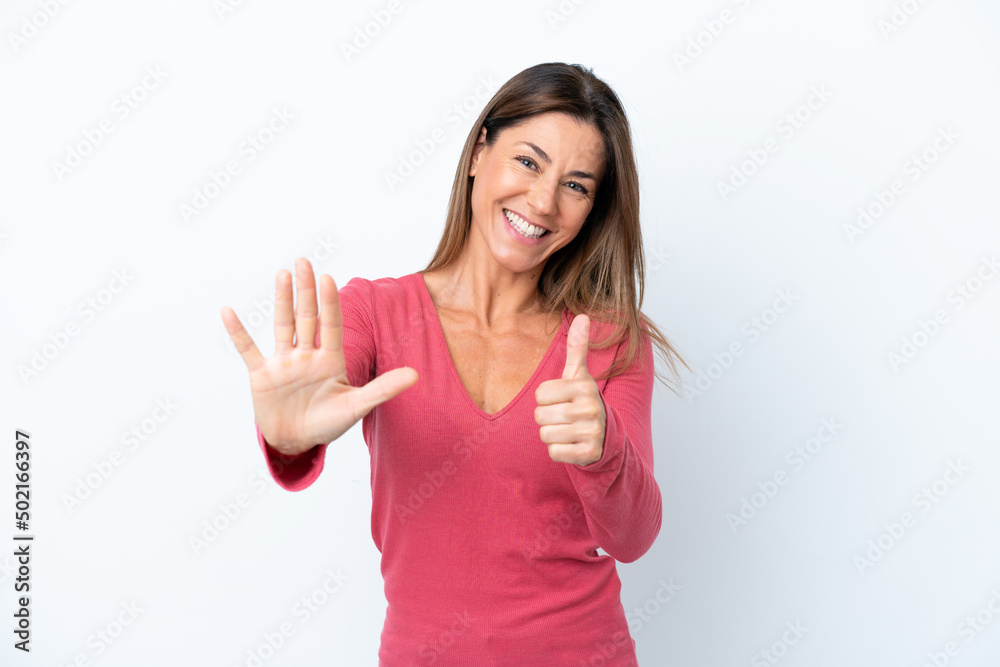 Middle age caucasian woman isolated on white background counting six with fingers Middle age caucasian woman isolated on white background counting six with fingers