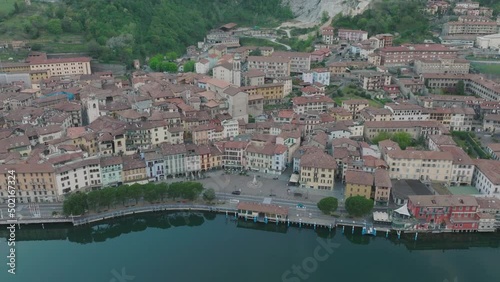 Aeriel view of Lake Iseo at sunrise, the city of lovere which runs along the lake,Bergamo Italy. photo