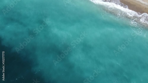 A flight over the blue sea flying to the village beach. High quality FullHD footage