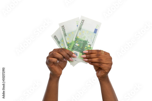 finance, currency and people concept - close up of female hands holding euro money over white background