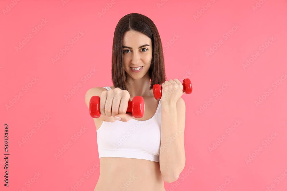Concept of weight loss, young woman on pink background Concept of weight loss, young woman on pink background
