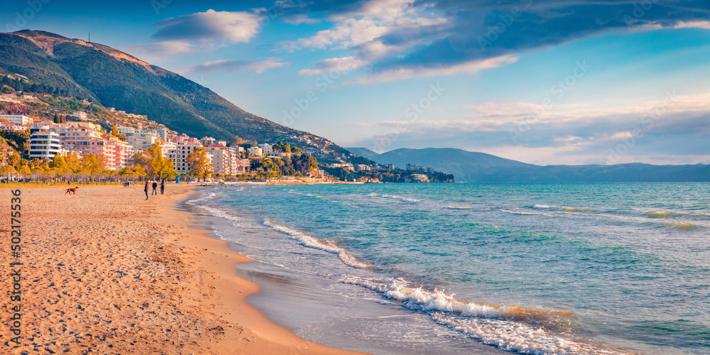 Sunny summer cityscape of Vlore town. Nice morning seascape of Adriatic sea. Splendid outdoor scene of Albania, Europe. Traveling concept background.
